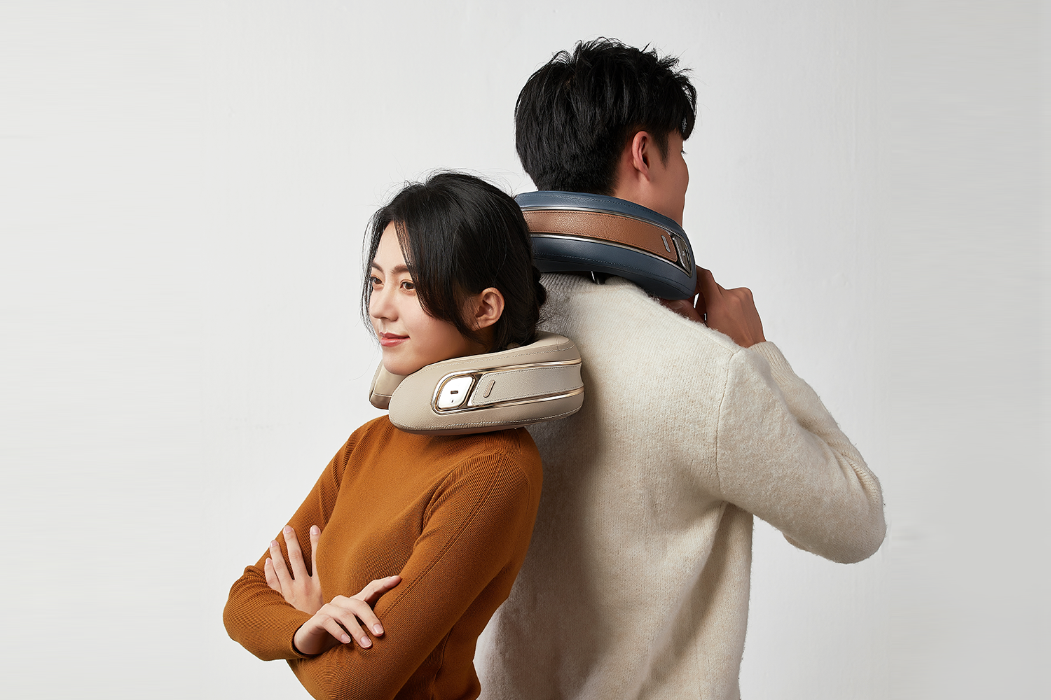 Two people wearing Dolores Ultra shoulder and neck massagers
